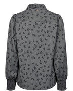 Floral patterned blouse on a white background