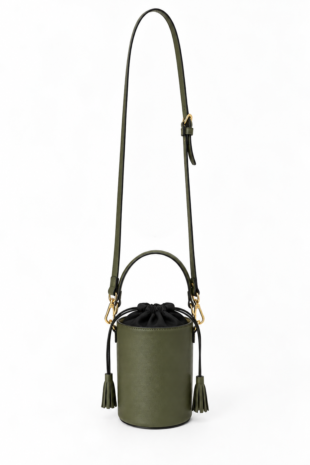 An olive green leather bucket bag with a black drawstring closure, black tassels, a black shoulder strap, and gold-tone hardware, shown on a plain white background.