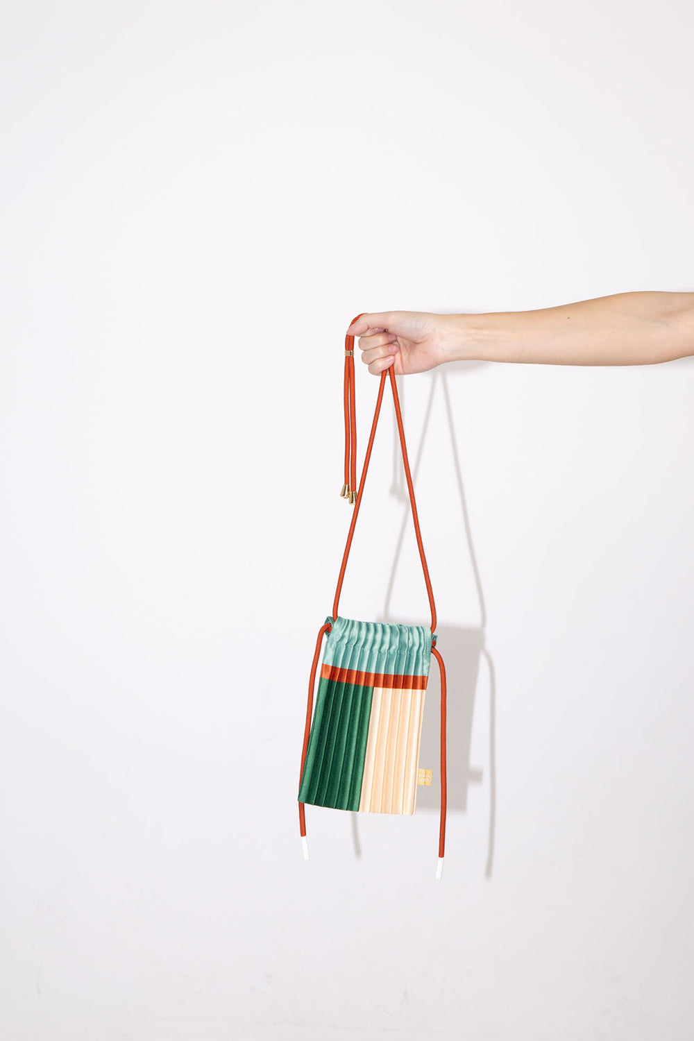 Satin pleated crossbody mini bag Emerald