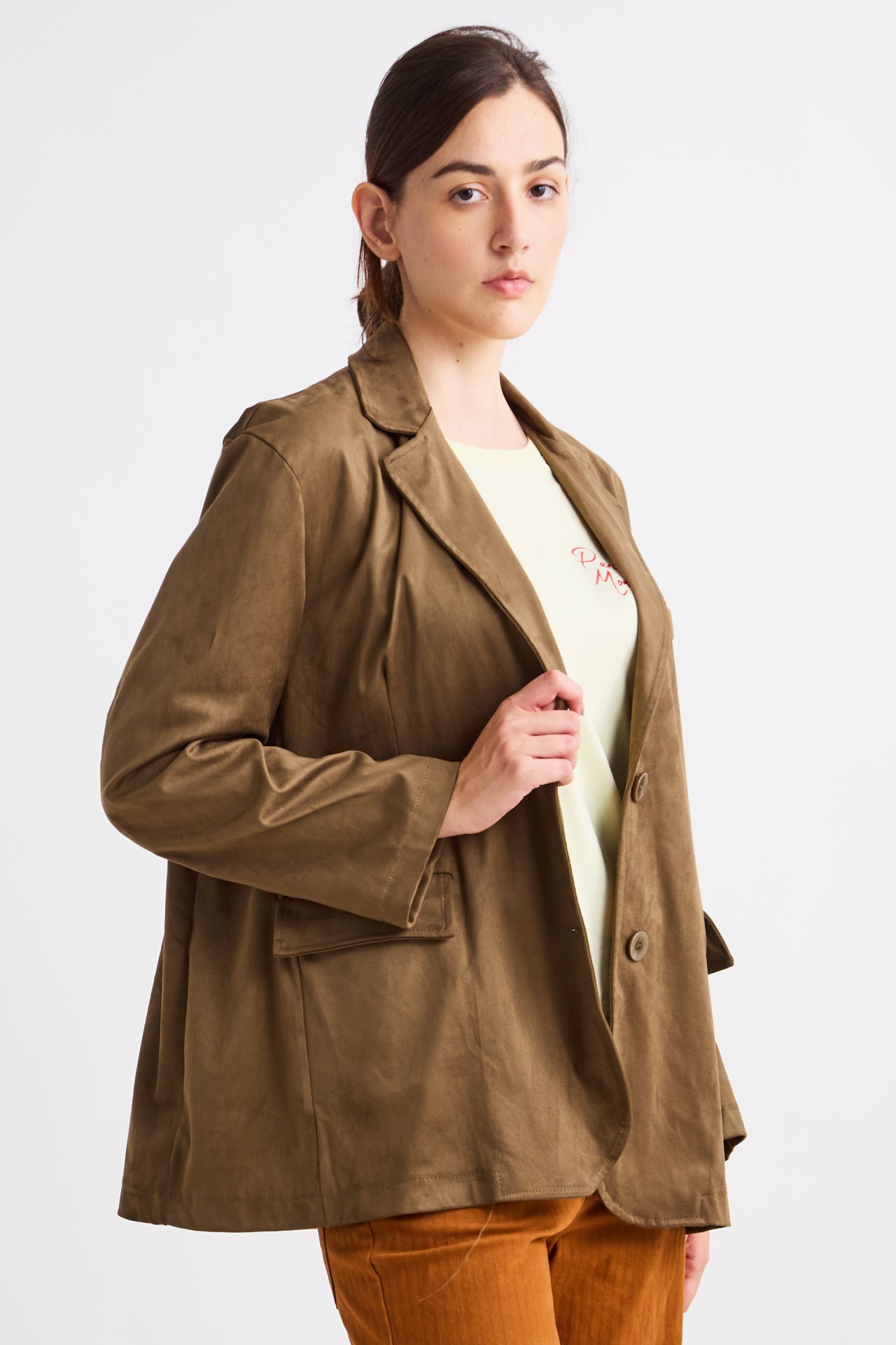 Woman wearing a brown jacket on a white background