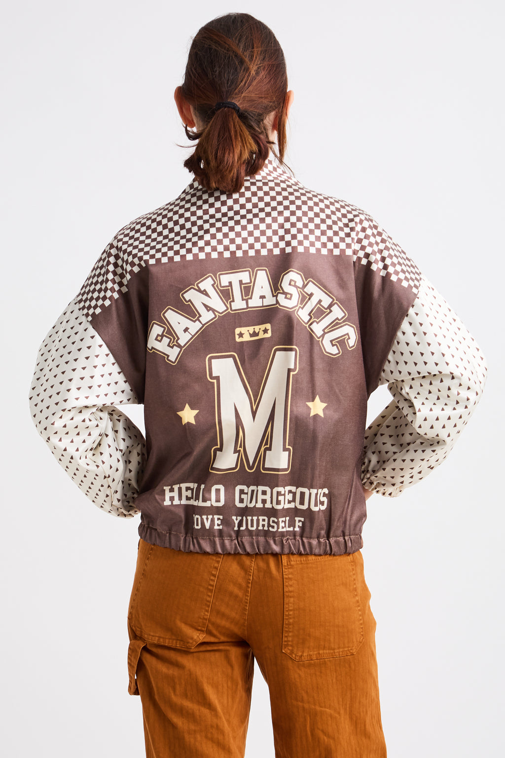Person wearing a checkered jacket with text and graphics on a white background