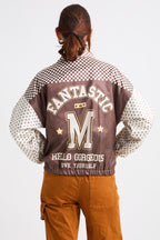 Person wearing a checkered jacket with text and graphics on a white background